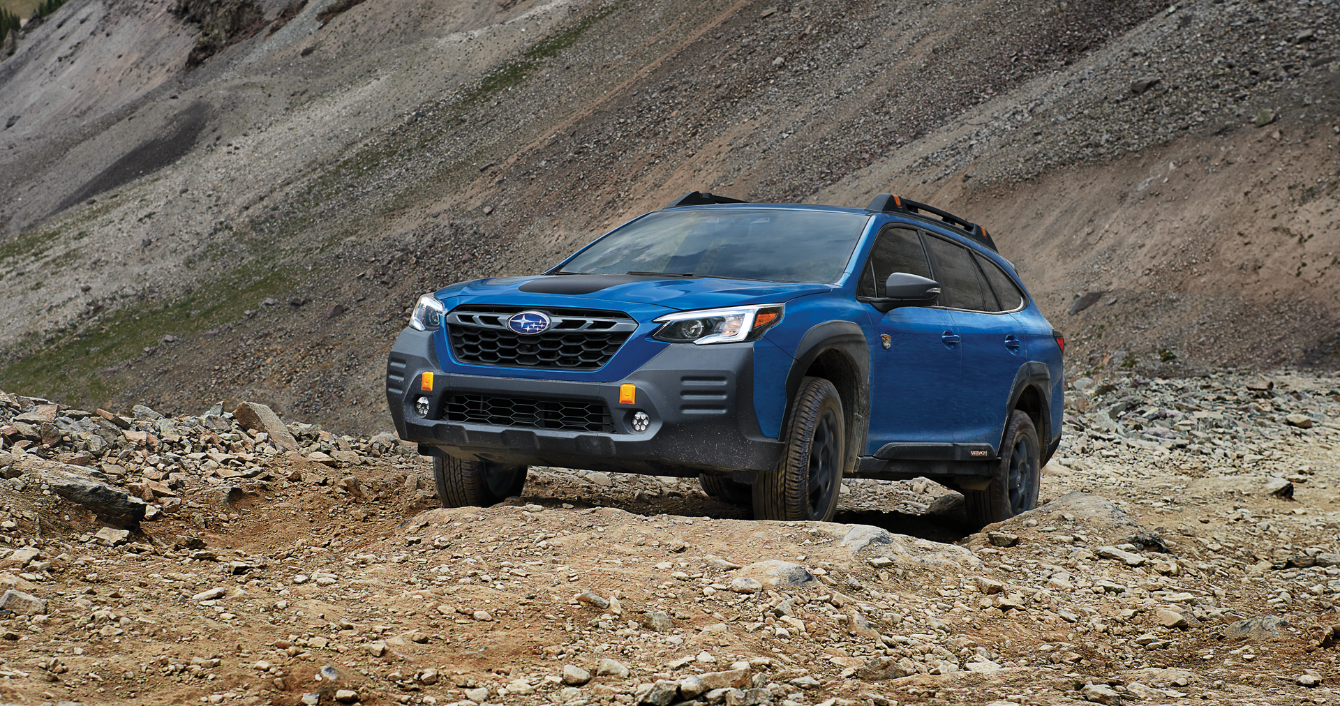 A 2023 Outback Wilderness driving on a trail in the mountains. | Wyatt Johnson Subaru in Clarksville TN