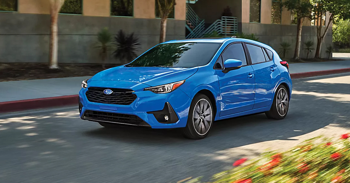 A Subaru Impreza driving through city streets.